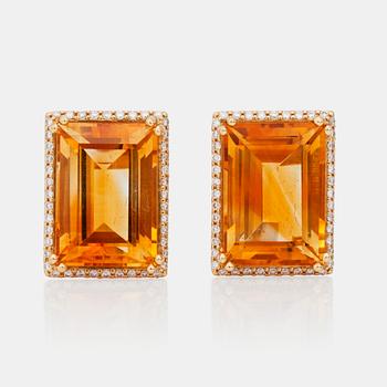 A pair of diamond and citrine earrings.