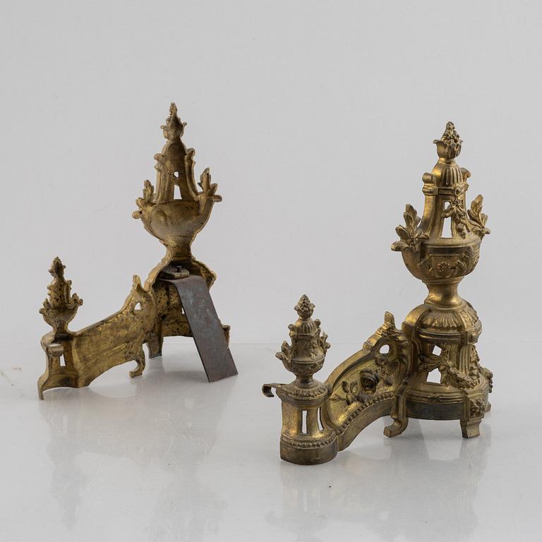 A pair of Louis XVI-style bronze andirons, France, later part of the 19th century.