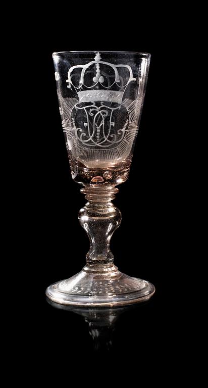 A large Bohemian engraved and cut goblet with the Royal monogram of the Swedish King Adolf Fredrik and his Queen Lovisa Ulrika, 18th Century.