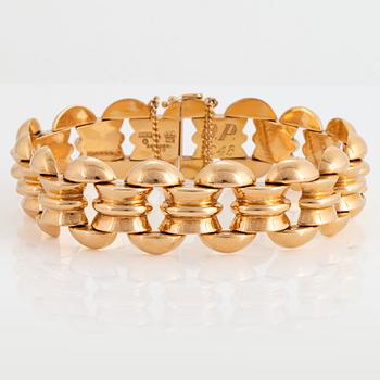 1000. An 18K gold bracelet.