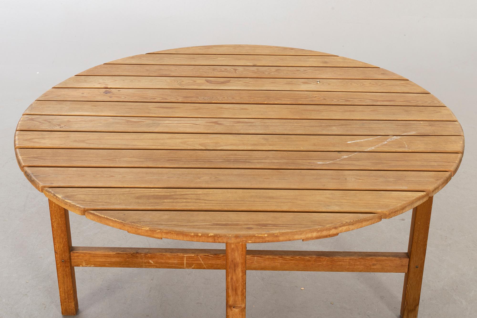 A circular garden table, probably Elsa Stackelberg for Fri Form.