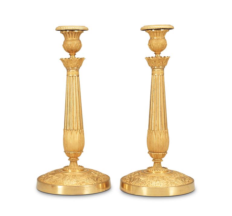 A pair of French late Empire first half 19th Century candlesticks.