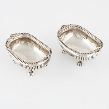 A pair of English Silver Salt Cellars, marks ofJoseph Angell Il 1823 and Samuel Dutton 1826 respectively, London.