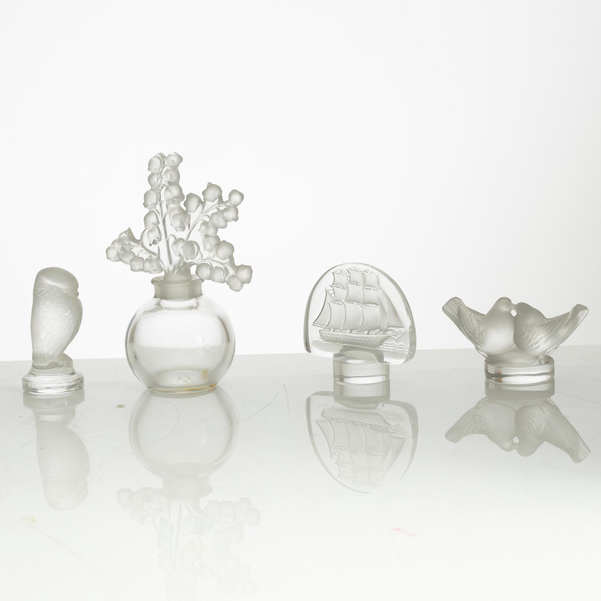 Lalique, four perfume bottles and five figurines, France, after 1945.