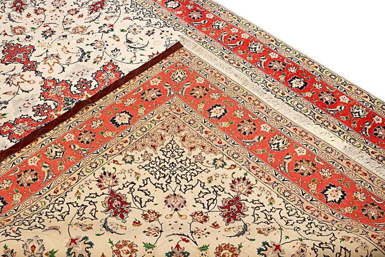 A Tabriz, part silk carpet, c. 300 x 199 cm.