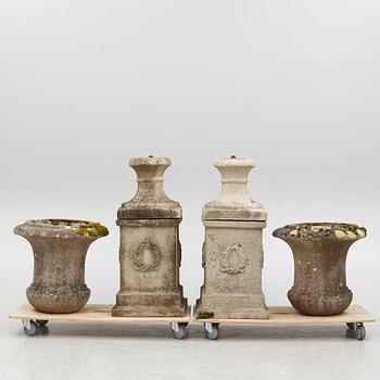 Garden urns, a pair on pedestals, 20th century.