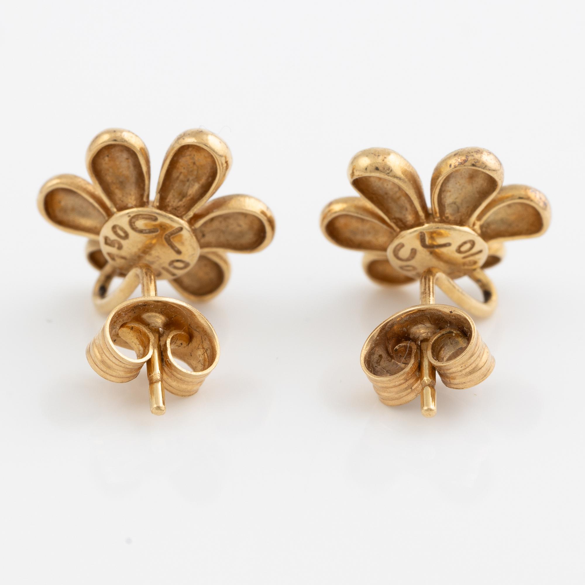 Ole Lynggaard a pair of earrings in 18k gold set with round brilliant-cut diamonds.