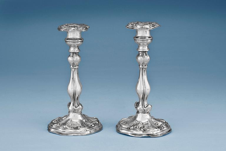 A PAIR OF CANDLE HOLDERS.