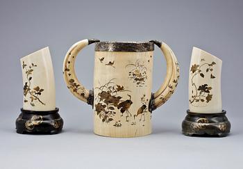 A set of three Japanese lacquered ivory vases, Meiji period, ca 1900.