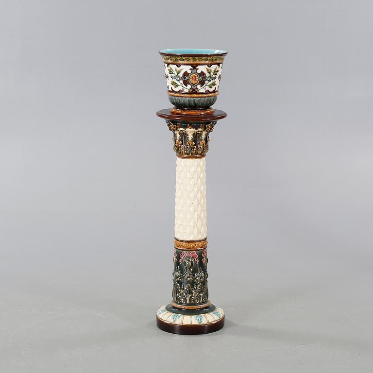 A Rörstrand pedestal with pot in majolica, made around year 1900.