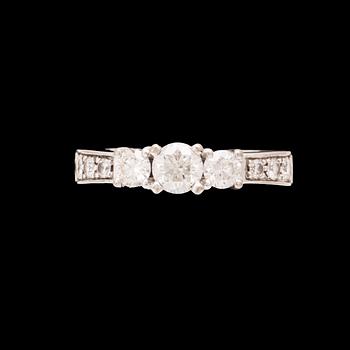 An 18K white gold ring set with round brilliant cut diamonds.