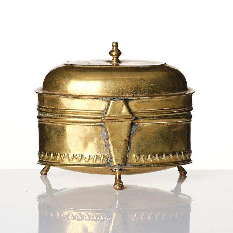 A baroque repousse brass pyxis, 18th century.