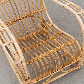 A pair of mid 20th century rattan easy chairs.