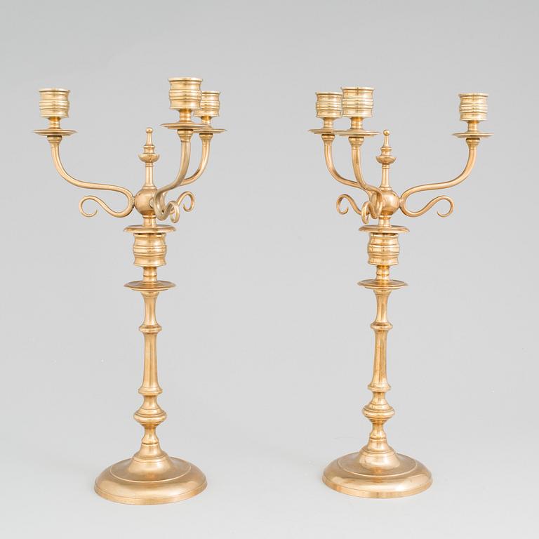 A pair of Candelabra, in brass Westerås Metallfabriks AB, late 19th century.