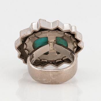 Grima ring 14K vitguld med turkos och runda briljantslipade diamanter.
