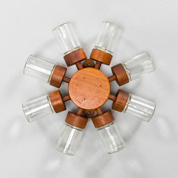 A Danish 1960s wall mounted spice rack in teak and glass from Digsmed.