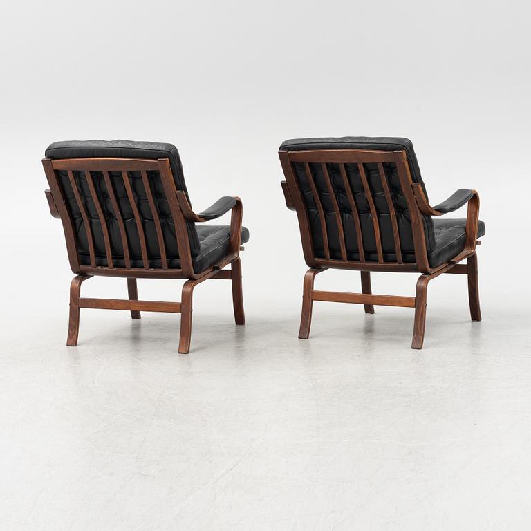 A pair of beechwood and leather armchairs, Göte Möbler, Nässjö, Sweden, second half of the 20th century.