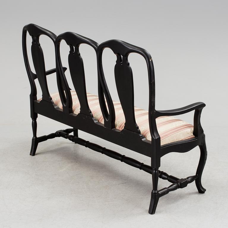 A mid 1900s rococo style sofa.
