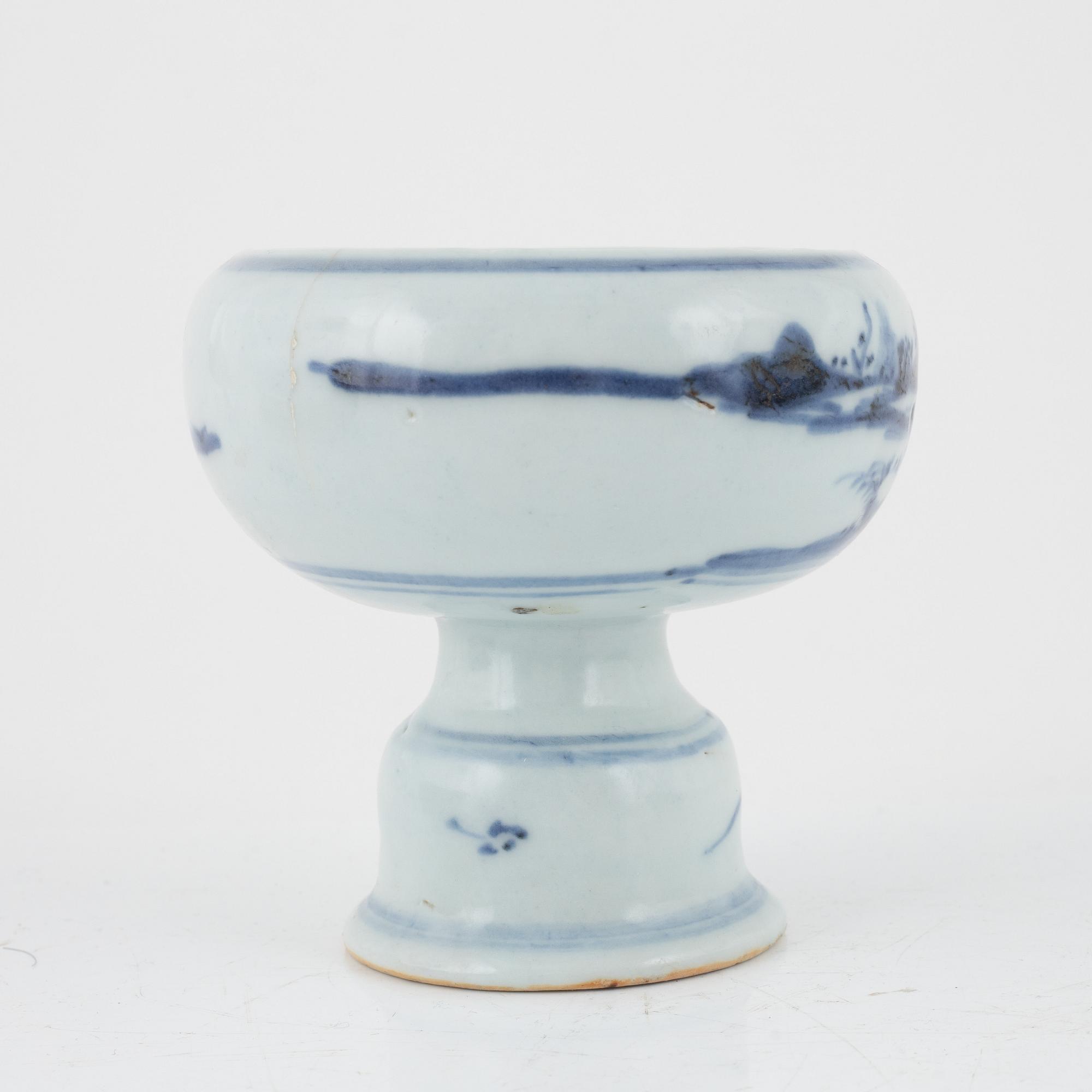 A blue and white stemcup and two dishes, Qing dynasty, 18th Century.