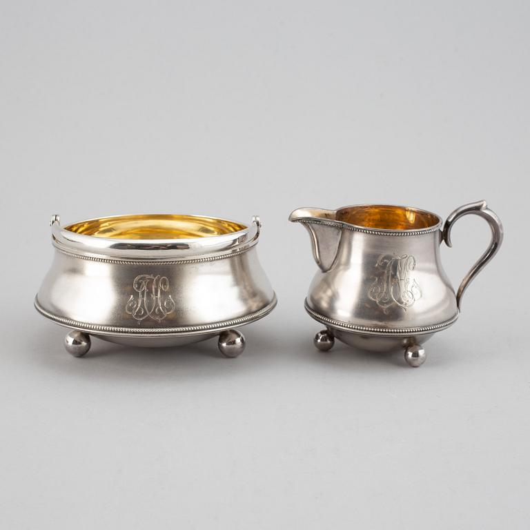 A parcel-gilt silver creamer and bowl, St Petersburg 1898-1903.