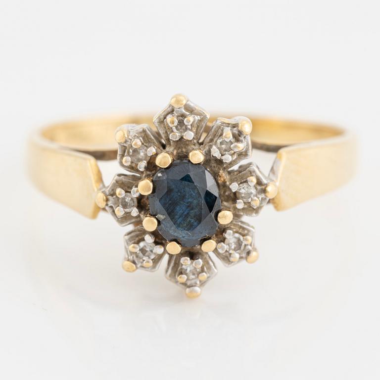 Ring with sapphire and octagonal cut diamonds.