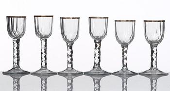 A set of 12 cut and gilded wine glasses, circa 1800.