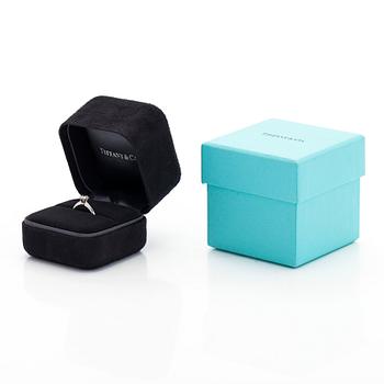 Tiffany & Co, a platinum solitaire ring with a brilliant-cut diamond.