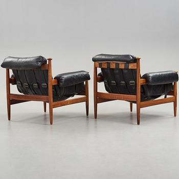 A pair of 'Amiral' easy chair by Eric Merthen.