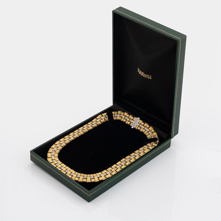An 18K gold necklace set with round brilliant-cut diamonds.