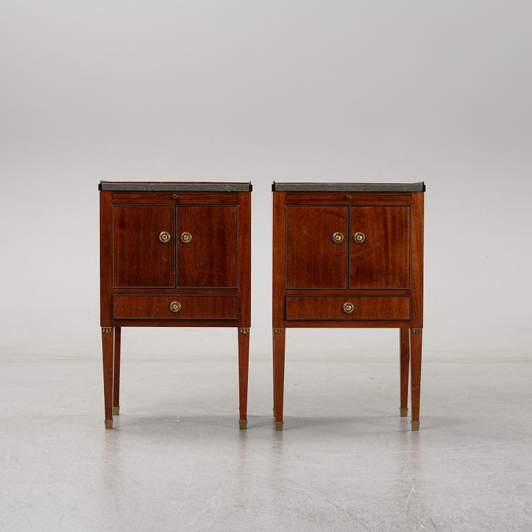 A pair of mahgany veneered bedside cabinets, early 20th Century.