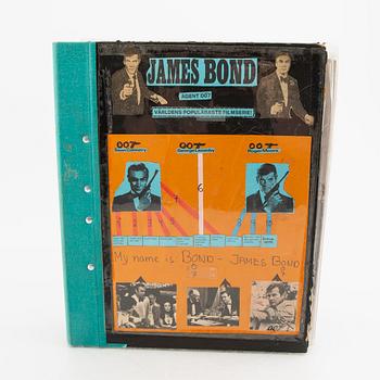 Collector's folder, James Bond, photographs and other clips from, among others, "Dr. No", "Goldfinger", Åskbollen and ot.