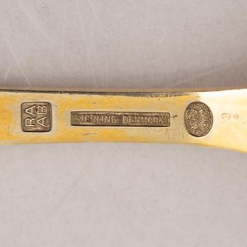 Georg Jensen, Christmas spoons/annual spoons, 13 pcs, gilded silver, Denmark 1971-1983.