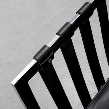 LUDWIG MIES VAN DER ROHE, a 'Barcelona' black leather lounge chair, Knoll Studio.