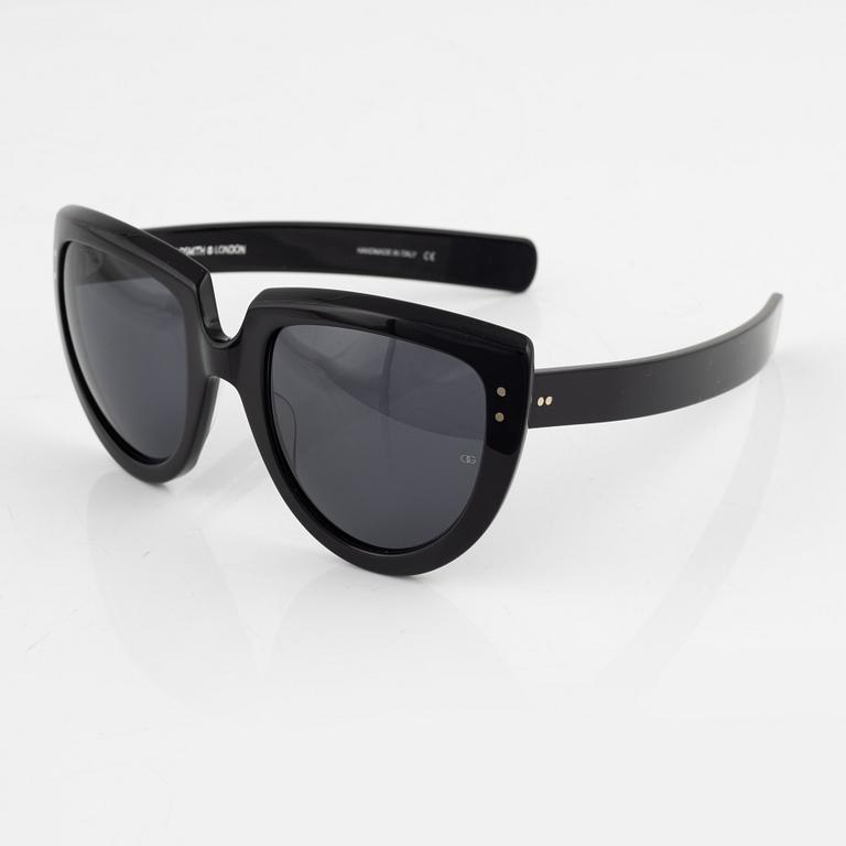 Oliver Goldsmith, a pair of black "Y-not" sunglasses.