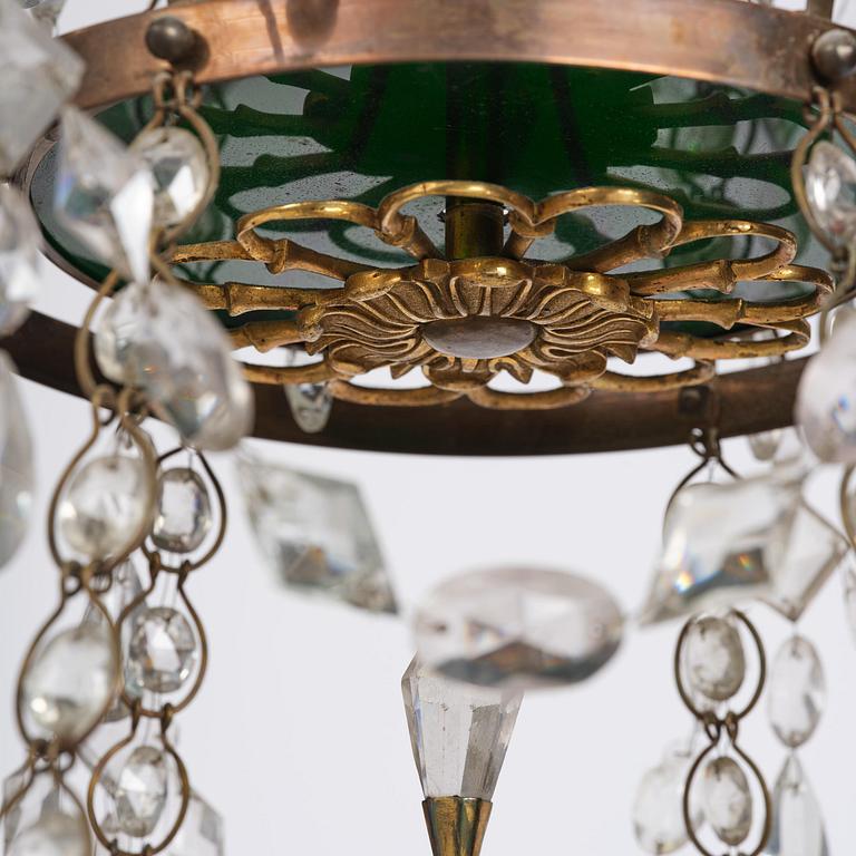 A Late gustavian green top glass six light chandelier.