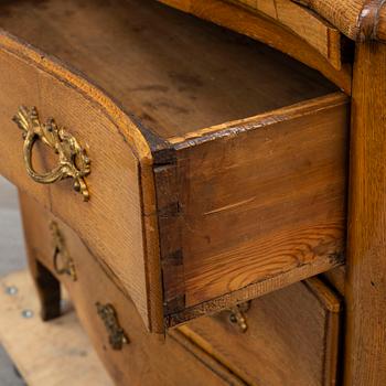 A 18th century rococo chest of drawers.