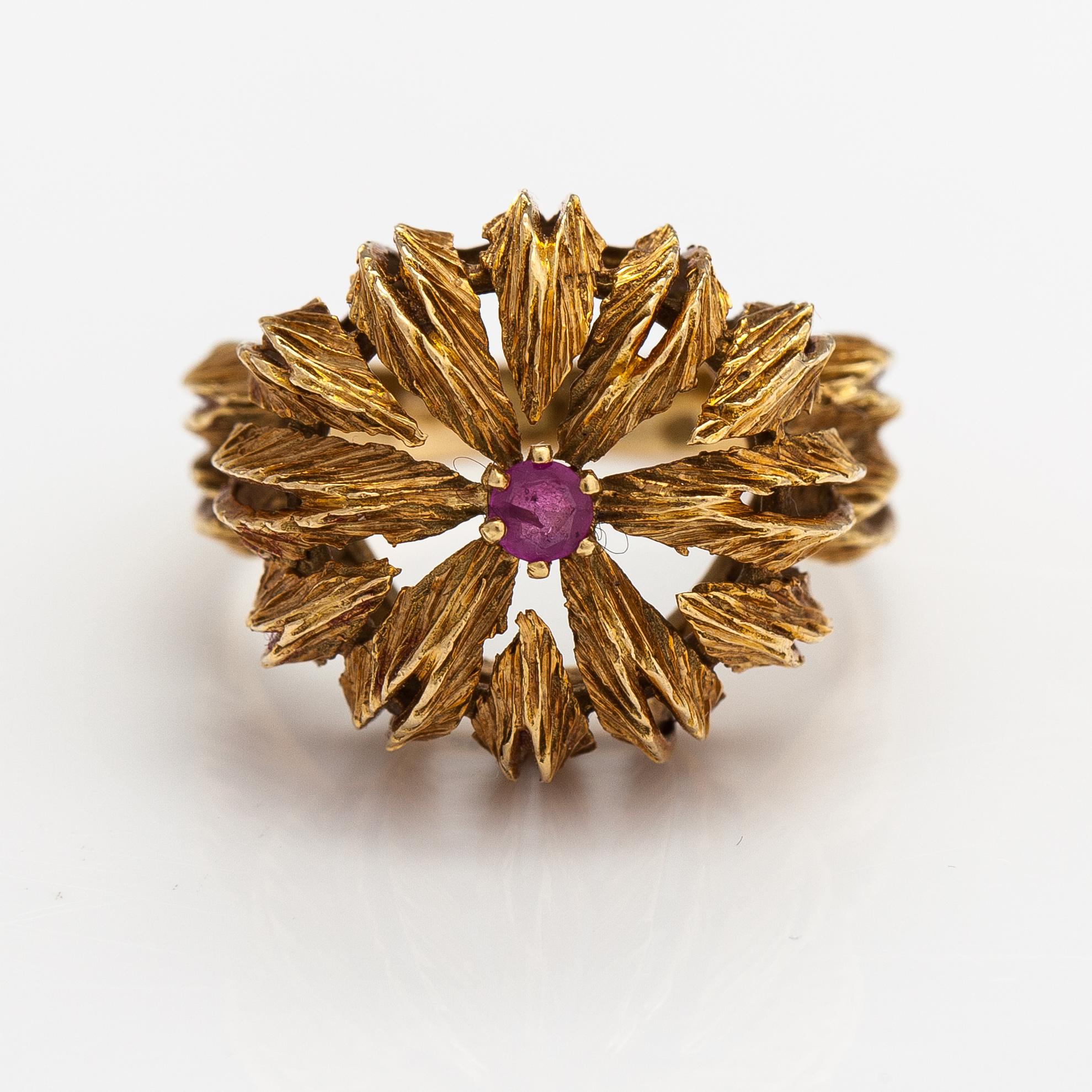 An 18K gold ring with a ruby.