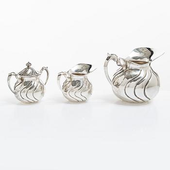 A sterling silver jug, milk jug and sugar bowl, possibly Mexico, mid20th century.