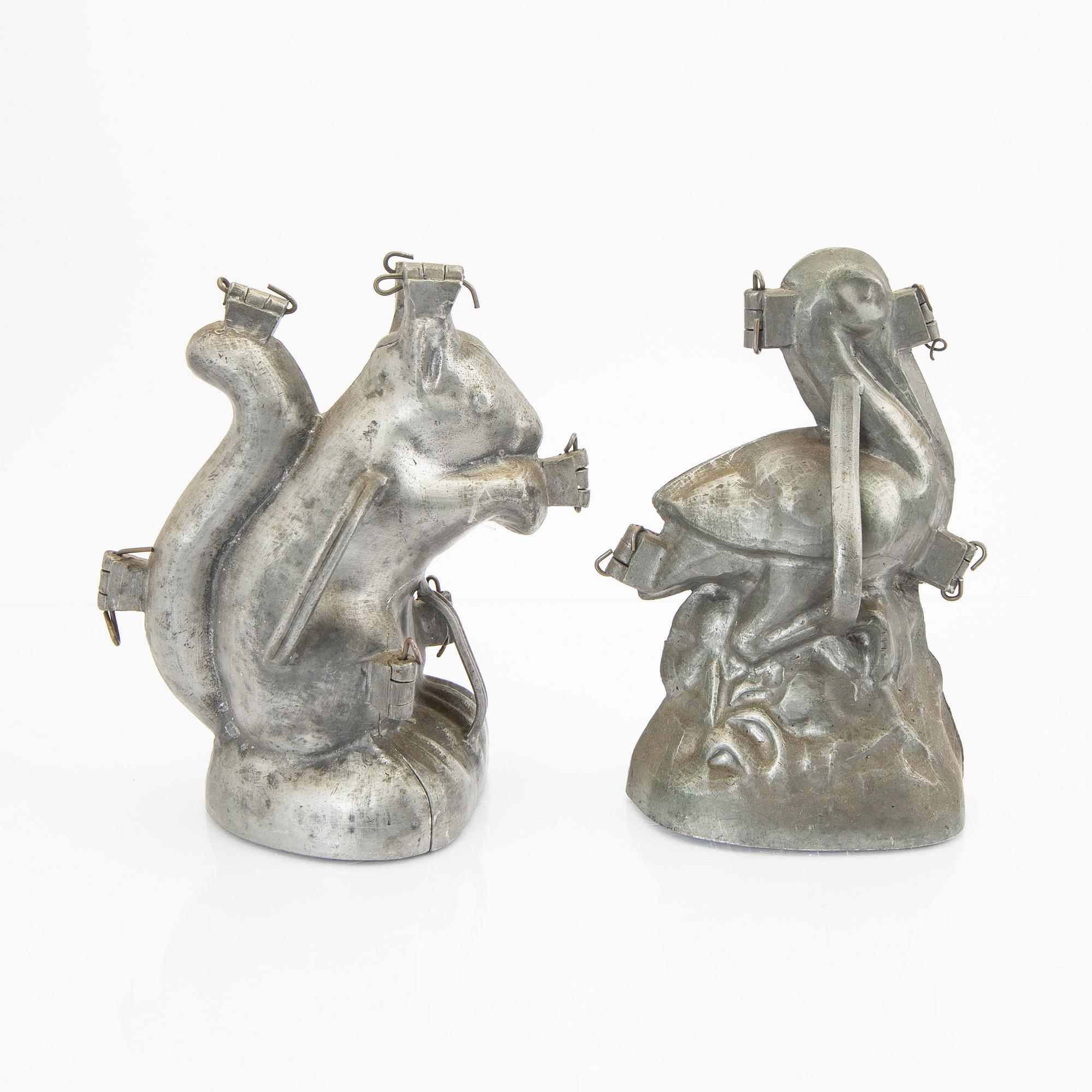 A set of four pewter icecream moulds around 1900.