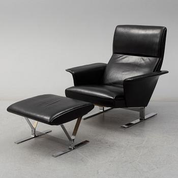 A second half of the 20th century easy chair and stool by Georg Thams, Vejens Polstermöbelfabrik, Denmark.