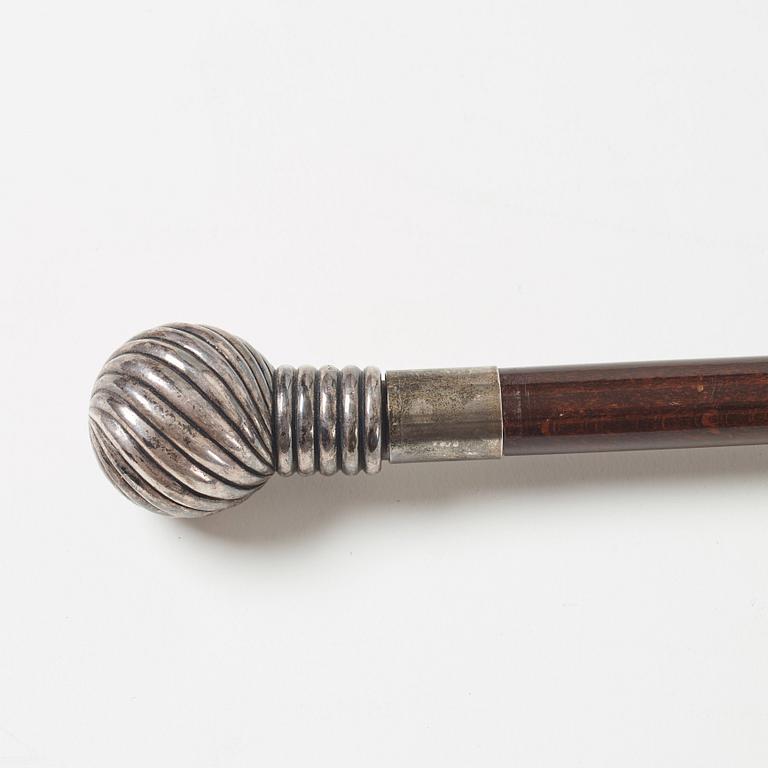 A cane, circa 1900.