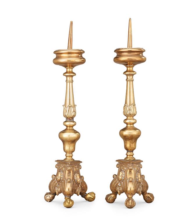 A pair of probably Flemish 17th century brass pricket candlesticks.