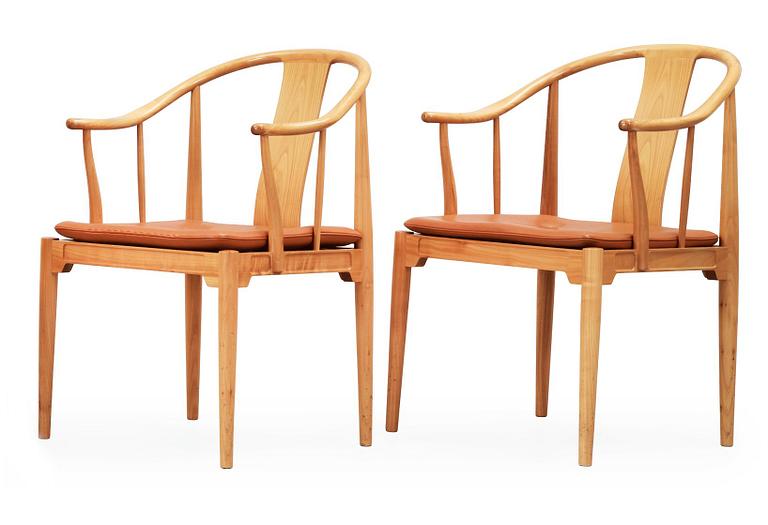 A pair of Hans J Wegner cherry and brown leather 'China chairs', Fritz Hansen, Denmark 1988-89.