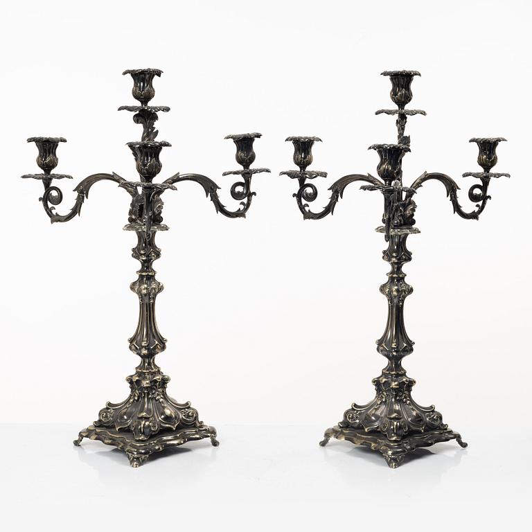 A pair of silver plated Rococo style candelabra, 20th century.
