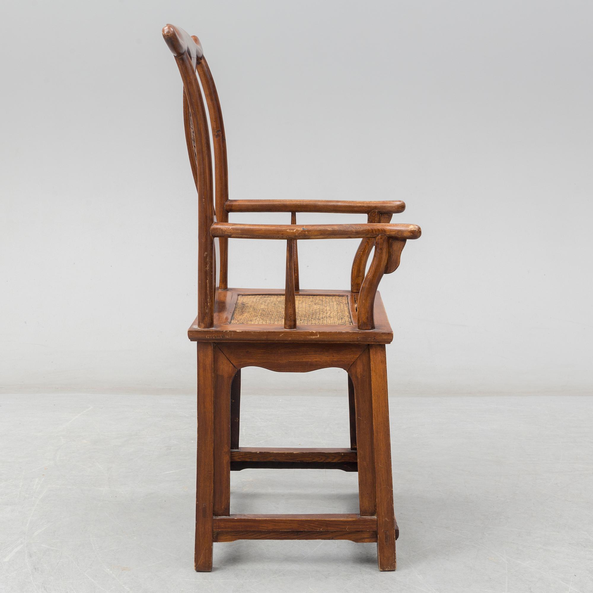 A Chinese wooden armchair, 20th century.