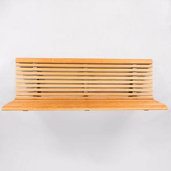 OLLE ANDERSON, A Swedish wall mounted wooden bench manufactured by Nola in the 2000s.