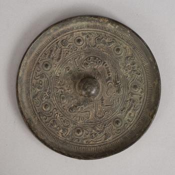 569. A bronze mirror, Han dynasty (206 B.C - 220 A.D).