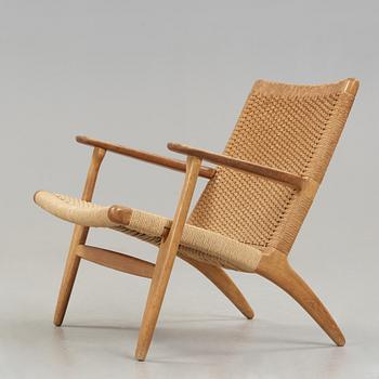 A Hans J Wegner 'CH-25' oak easy chair, Carl Hansen & Son, Denmark.