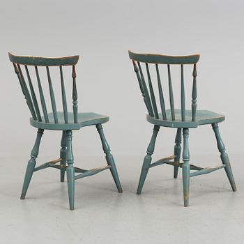 A pair of late 19th century painted chairs.