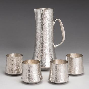 TAPIO WIRKKALA, A silver pitcher with four silver beakers, marked TW, Kultakeskus oy, Hämeenlinna Finland 1973 and 1977.